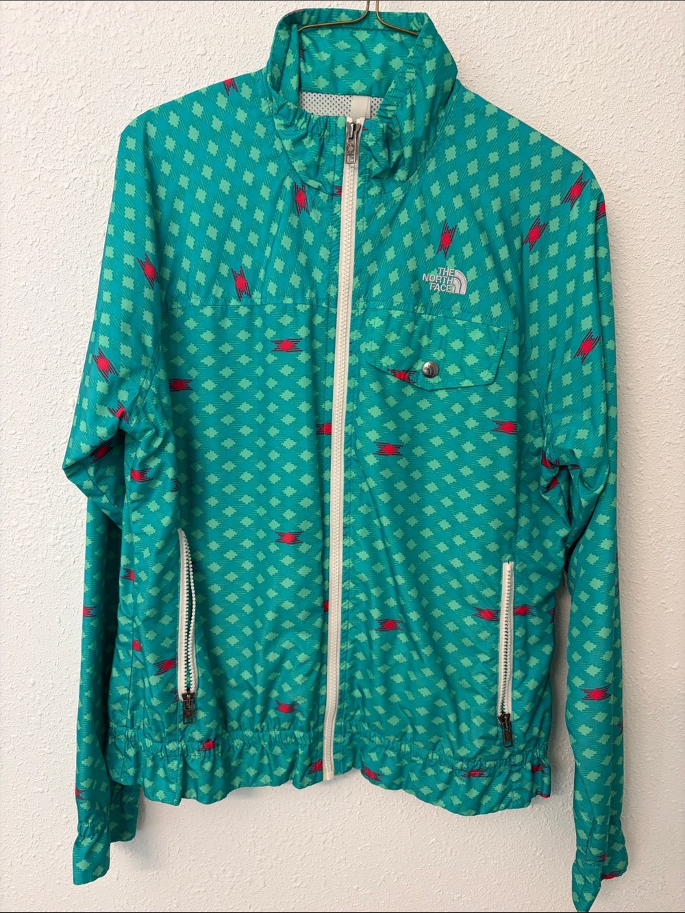The North Face Teal Diamond-Print Windbreaker with Red Accents